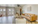 Bright living room featuring a leather sofa and access to a patio at 1234 Calcione Dr, Henderson, NV 89011