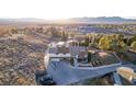 House on a hill with mountain views and a spacious yard at 1400 San Felipe Ct, Boulder City, NV 89005
