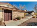 View of the front entrance with decorative gate at 2373 Cardiff Ln # A, Las Vegas, NV 89108