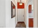 Bright entryway with a mirror and red accent wall at 2755 Sunken Ship St, Laughlin, NV 89029