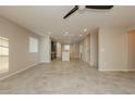 Open living room with tile floors and views into kitchen at 368 Gracious Way, Henderson, NV 89011