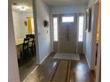 Bright entryway with wood-look floors, leading to dining area at 3940 Edgemoor Way, Las Vegas, NV 89121
