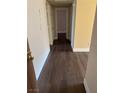 Hallway with dark brown wood-look flooring at 4965 Indian River Dr # 103, Las Vegas, NV 89103