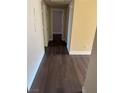 Hallway with dark brown wood-look flooring at 4965 Indian River Dr # 103, Las Vegas, NV 89103