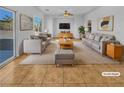 Virtually staged living room featuring ample seating and a modern aesthetic at 7100 Estrella De Mar Ave, Las Vegas, NV 89131