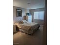 Spacious bedroom with dresser and window at 7964 Rim Rock Way # 102, Las Vegas, NV 89128