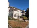 Building exterior with stairs and landscaping at 7964 Rim Rock Way # 102, Las Vegas, NV 89128