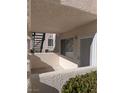 Private patio with exterior access and stairs at 7964 Rim Rock Way # 102, Las Vegas, NV 89128