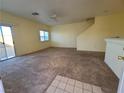 Spacious living room with carpeted floors and ceiling fan at 8834 Duncan Barrel Ave # 103, Las Vegas, NV 89178