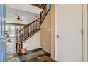 Entryway with tiled floor, staircase, and interior view at 10489 Bolting Cloud Dr, Las Vegas, NV 89178