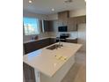 Spacious kitchen with island, stainless steel appliances, and light countertops at 127 Harmonica Ave # Lot 14, Henderson, NV 89011