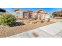 Two-story house with front yard landscaping and a two-car garage at 1426 Radig Ct, Boulder City, NV 89005