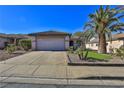 House exterior showcasing a two-car garage and desert landscaping at 167 White Butte St, Henderson, NV 89012