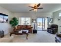 Spacious living room with lots of natural light, comfortable furniture, and a view at 1848 Mountain Ranch Ave, Henderson, NV 89012