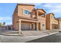 Two-story house with attached garage and front yard landscaping at 1992 Star Creek Bay Ln, Las Vegas, NV 89115