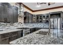 Modern kitchen with granite countertops and stainless steel appliances at 2051 Saginaw Ave, Pahrump, NV 89048