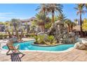 Relaxing community pool area with palm trees and seating at 4200 S Valley View Blvd # 1083, Las Vegas, NV 89103