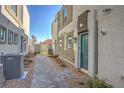 Modern building exterior with a private walkway and well-maintained landscaping at 4278 Lemay St # 2, Las Vegas, NV 89115