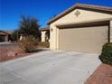 Attached garage with double doors and driveway at 4694 E Lucera Ct, Pahrump, NV 89061