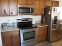 Kitchen features stainless steel appliances and granite countertops at 4694 E Lucera Ct, Pahrump, NV 89061