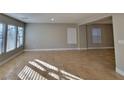 Bright living room with large windows and tile floors at 4823 Jubilee Diamond Ct, Las Vegas, NV 89139