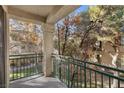 Private balcony overlooking a wooded area at 5155 W Tropicana Ave # 2123, Las Vegas, NV 89103