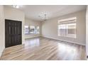 Bright and airy living room with hardwood floors and lots of natural light at 5306 Falling Petals Dr, North Las Vegas, NV 89031