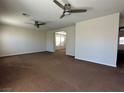 Generous living room features plush carpeting and great natural lighting at 5636 Granville Lake St, North Las Vegas, NV 89031