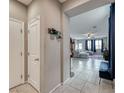 Hallway view of living room with tiled floors at 5658 Adobe Jack St, North Las Vegas, NV 89031