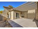 Covered patio with fireplace and pergola at 5744 Serenity Haven St, North Las Vegas, NV 89081