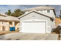 Two-story house with attached garage and neutral exterior at 5934 Clear Valley Ave, Las Vegas, NV 89142