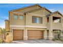 Two-story house with tan siding, brown garage doors, and a landscaped yard at 5969 Viscaya Grove St, Las Vegas, NV 89118