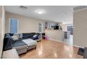 Spacious living room featuring a sectional sofa and wood floors at 6461 Karlsen Ct, Las Vegas, NV 89122