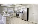 Kitchen features granite countertops and stainless steel appliances at 6812 Greydawn Dr, Las Vegas, NV 89108