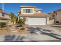 Two-story house with landscaped yard, two-car garage, and sunlit exterior at 716 Amber Hills Dr, Las Vegas, NV 89123