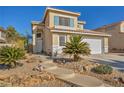 Two-story house with landscaped yard, two-car garage, and neutral color scheme at 716 Amber Hills Dr, Las Vegas, NV 89123