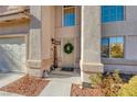 Inviting front entrance with decorative wreath and welcome sign at 8125 Caramel Gorge Ct, Las Vegas, NV 89143