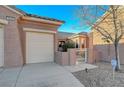 Attached two-car garage with a gate to the side yard at 2039 Colvin Run Dr, Henderson, NV 89052