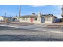 Charming ranch home with a red door and solar panels at 213 Valley Forge Ave, Henderson, NV 89015