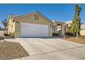 A charming single-story home with a wide driveway and neutral stucco at 3709 Ferrell St, North Las Vegas, NV 89032