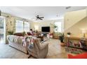 Living room with tiled floors, sectional sofa, and fireplace at 4350 New Suffolk St # 1, North Las Vegas, NV 89032