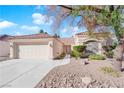 House exterior showcasing a front entrance and driveway at 4509 Crimson Leaf Dr, Las Vegas, NV 89130