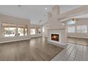 Spacious living room with a fireplace and wood-look flooring at 4509 Crimson Leaf Dr, Las Vegas, NV 89130