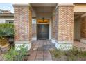 Elegant entryway with brick columns and double doors at 4649 Bird View Ct, Las Vegas, NV 89129