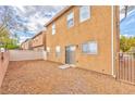 The backyard featuring low maintenance gravel and stucco walls at 5555 Sun Temple Ave, Las Vegas, NV 89139