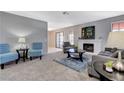 Spacious living room featuring a fireplace and comfortable seating at 6657 W Tropicana Ave # 201, Las Vegas, NV 89103