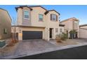 Two-story house with a dark brown garage door and landscaping at 6955 Sunrise Crest Dr, Las Vegas, NV 89142