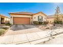 Single-story house with a two-car garage and desert landscaping at 766 Topocoba St, Las Vegas, NV 89178