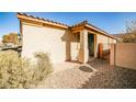 View of the front entry with a decorative gate at 766 Topocoba St, Las Vegas, NV 89178