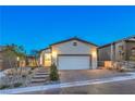 Modern single-story home with attached garage and landscaping at 92 Stone Bluff Ln, Henderson, NV 89011